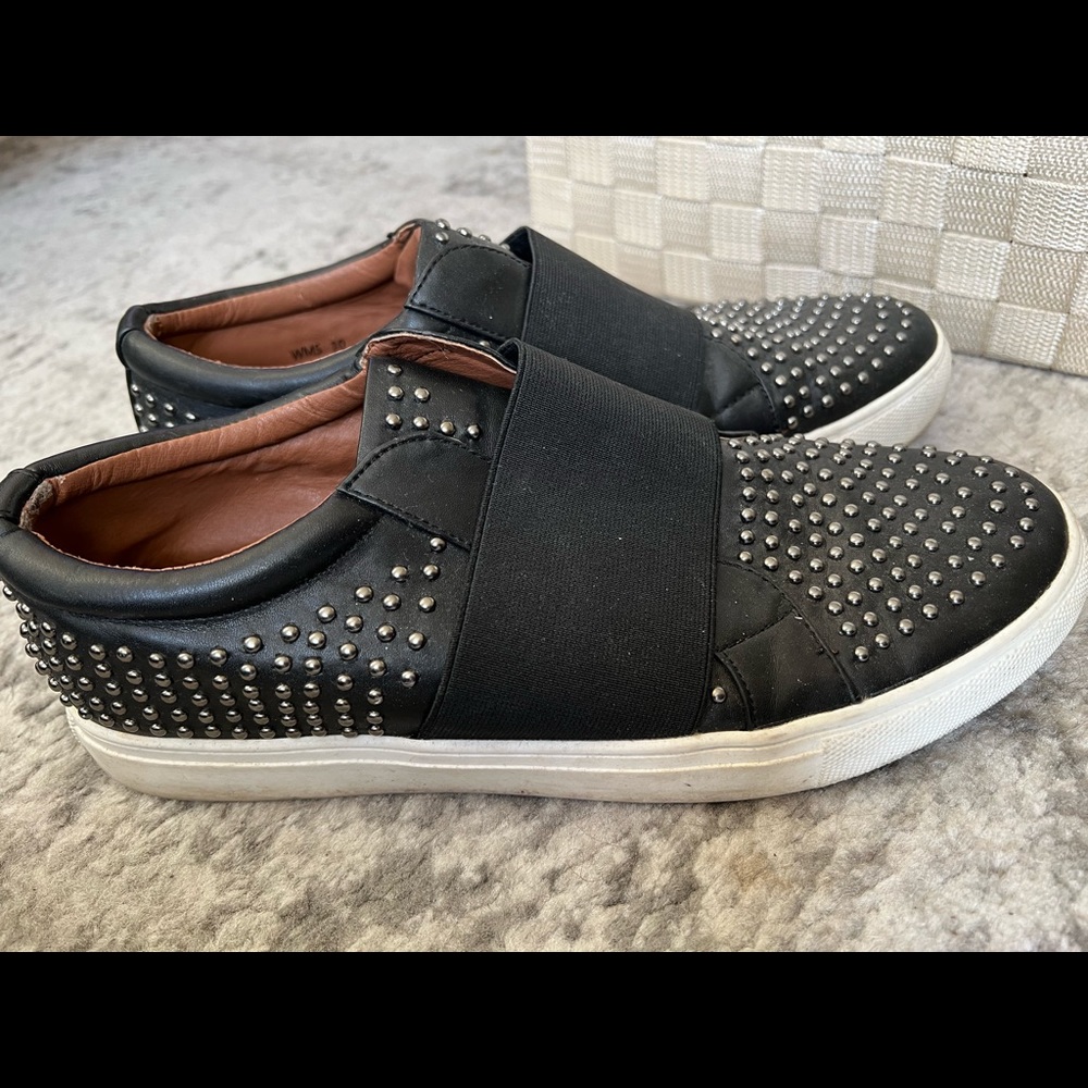Black slip on sneakers with studded details